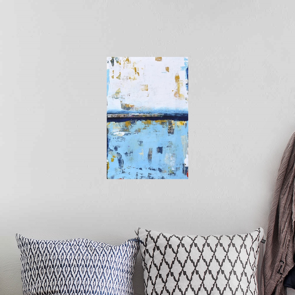 A bohemian room featuring A contemporary abstract painting using white and a pale blue meeting face to face.