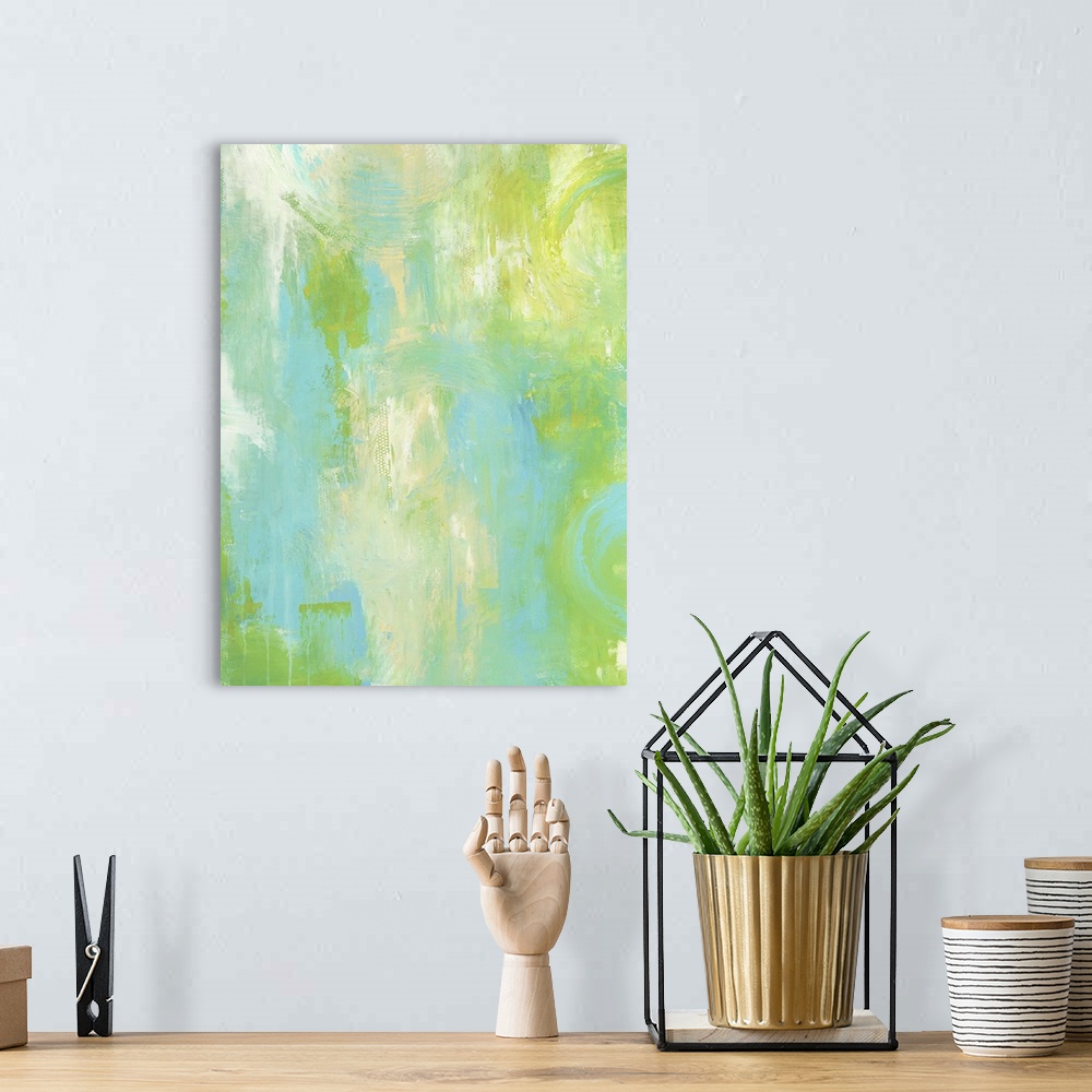 A bohemian room featuring A contemporary abstract painting using tones of light green and blue.