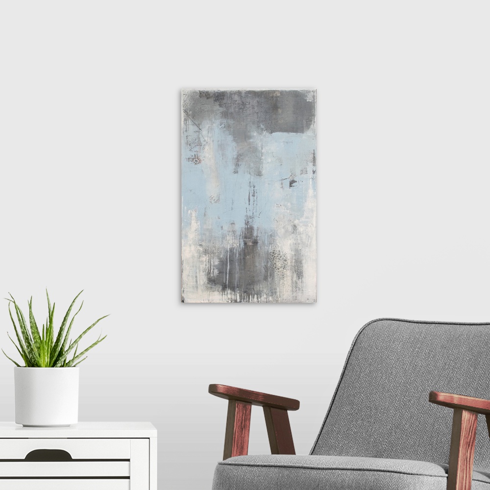 A modern room featuring Vertical abstract painting created with shades of gray, white, and light blue.