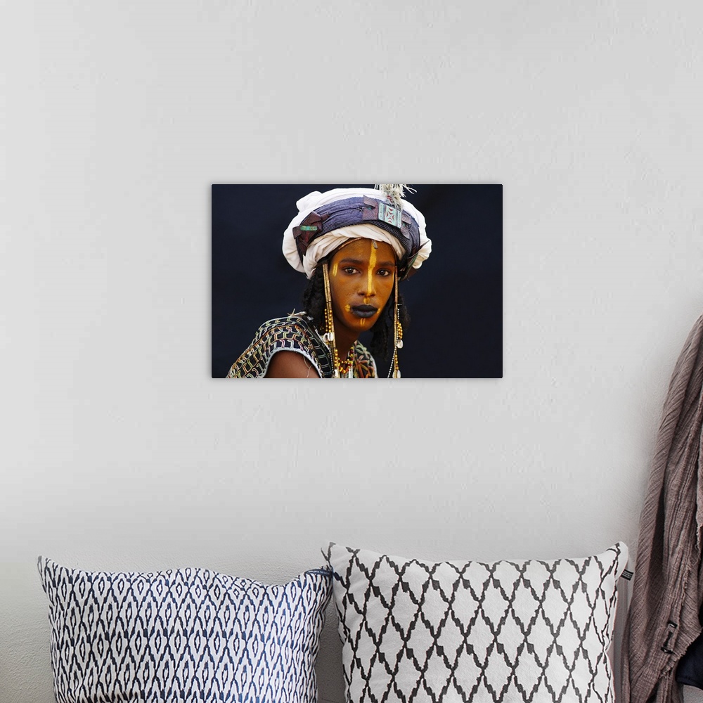 A bohemian room featuring Niger, A Wodaabe-Bororo boy with his face painted for the annual Gerewol male beauty contest