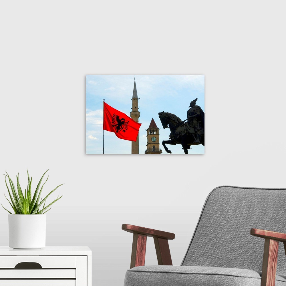 A modern room featuring Albania, Tirana, Scanderbeg statue in Scanderbeg square with Albanian flag