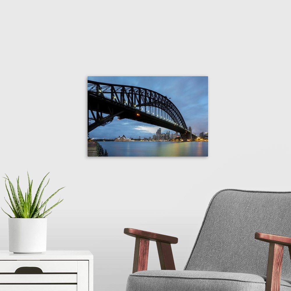 A modern room featuring Australia, New South Wales, Sydney, Sydney Harbor Bridge, The famous bridge at dawn, view with th...