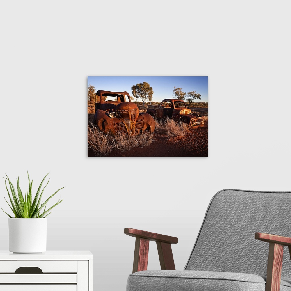A modern room featuring Australia, Northern Territory, Oceania, Devil's Marbles, old car wreck in the desert