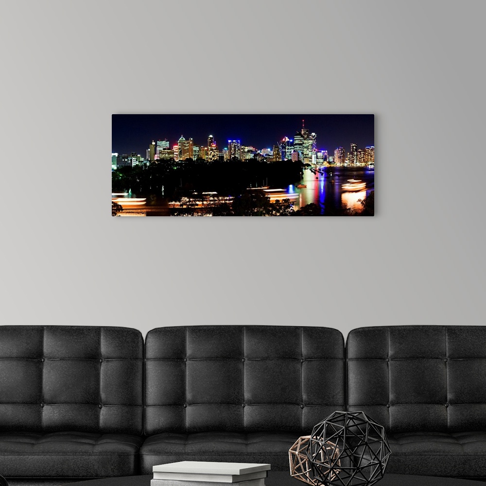 A modern room featuring Australia, Queensland, Brisbane, Night view of the city's skyline and the river