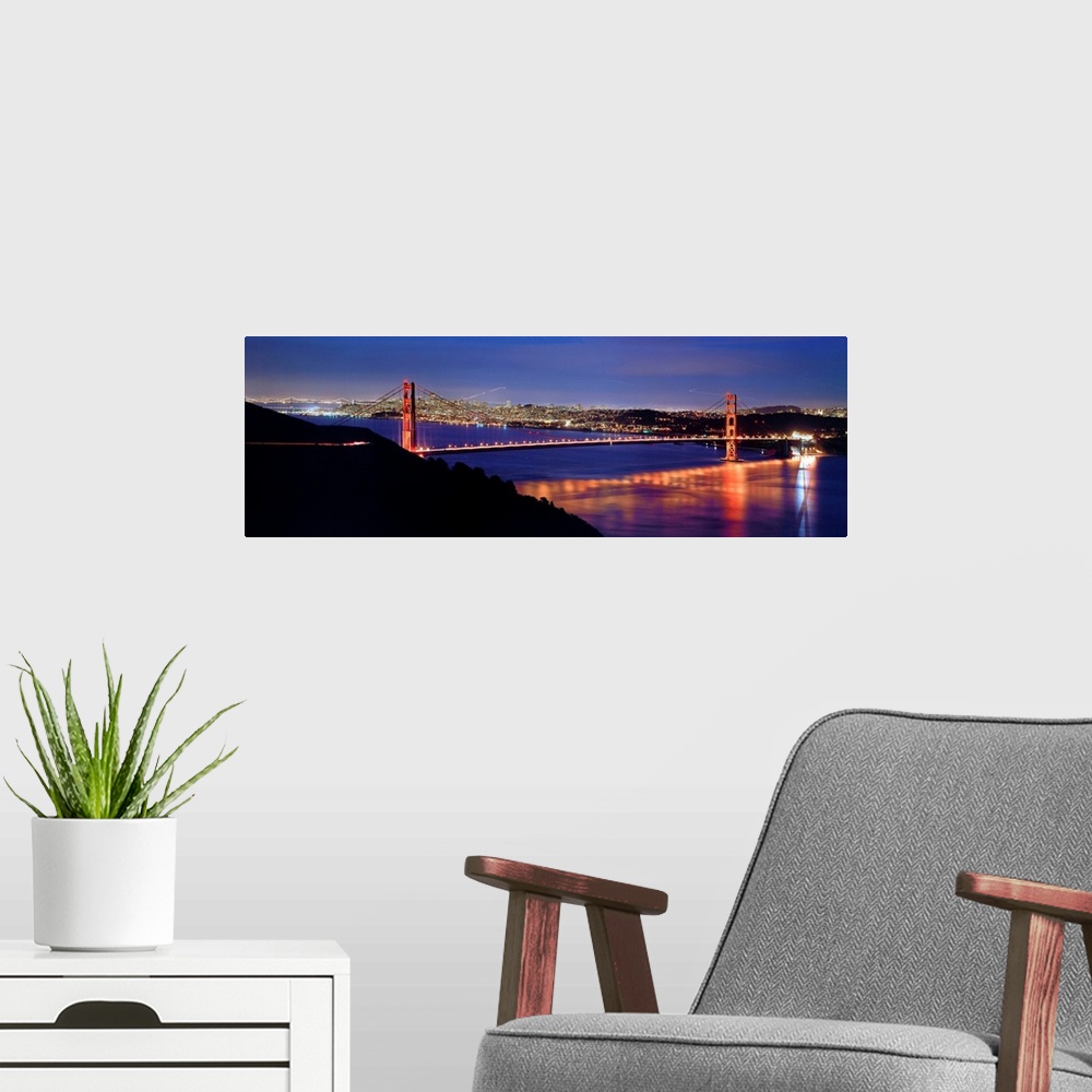 A modern room featuring CA, San Francisco, Golden Gate Bridge and the skyline at night