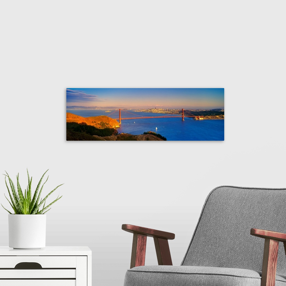 A modern room featuring CA, San Francisco, Golden Gate Bridge and the skyline at sunset