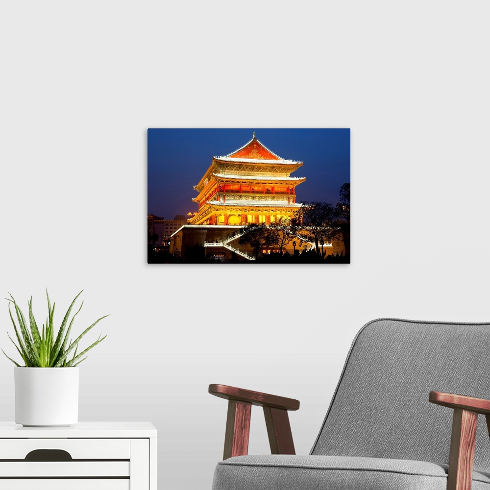 A modern room featuring China, Shanxi, Sian, Drum tower lit up at night in the centre of Xian.