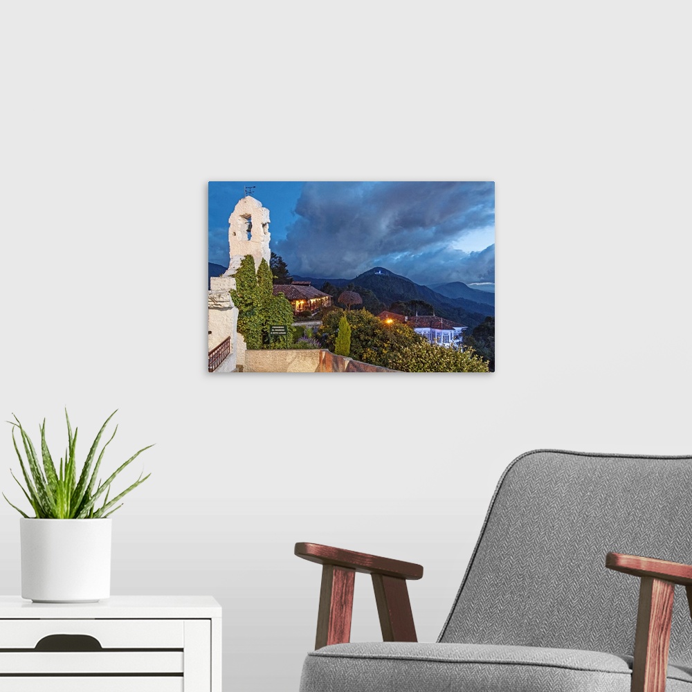A modern room featuring Colombia, Bogota, night scene from Monserrate hill