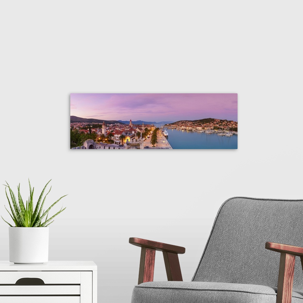A modern room featuring Croatia, Dalmatia, Trogir, Balkans, Adriatic Coast, Stari Grad (old town) illuminated at dusk.