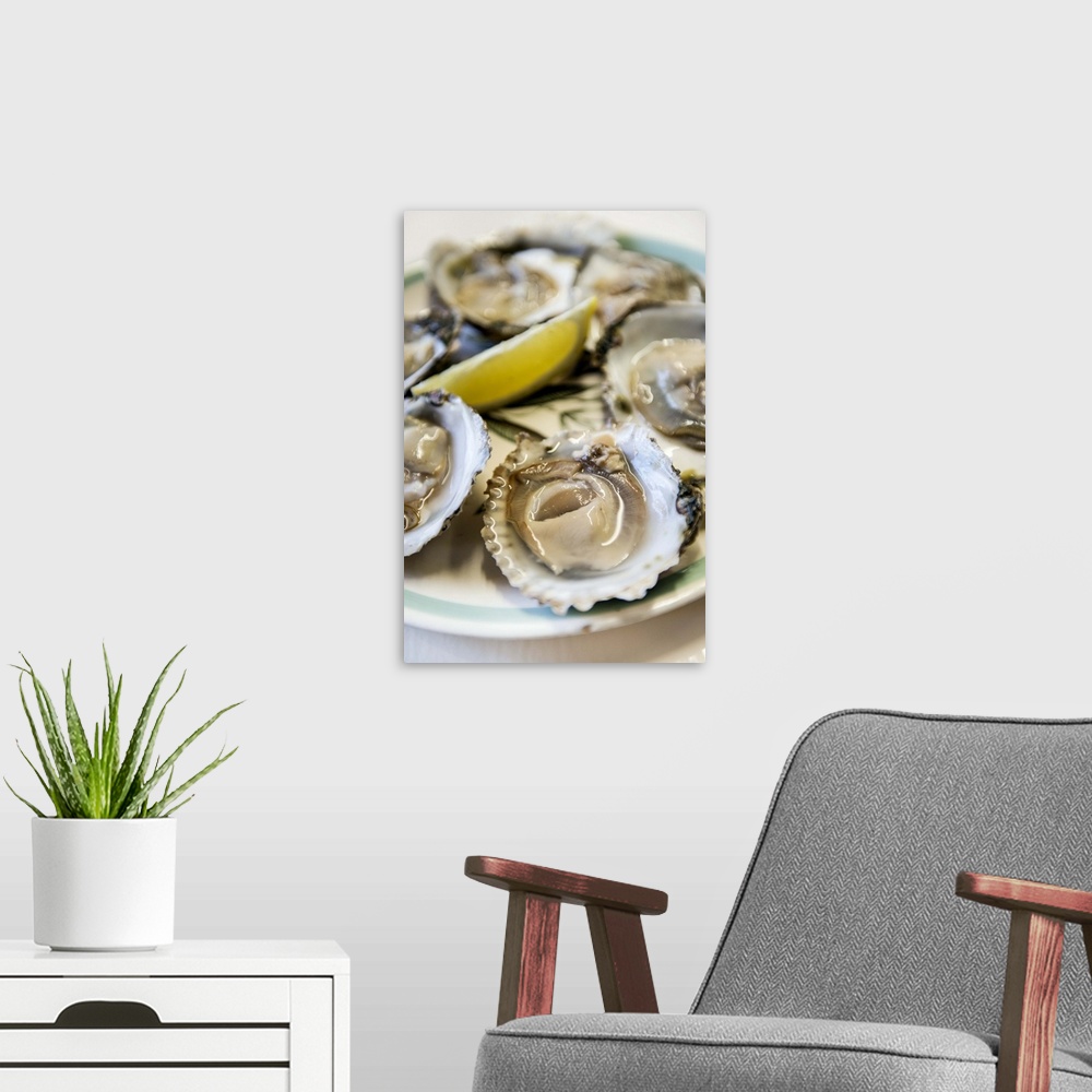 A modern room featuring UK, England, Kent, Whitstable, Oysters with lemon, Wheelers Oyster Bar.