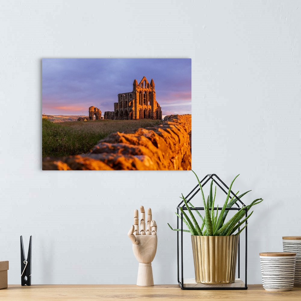 A bohemian room featuring England, North Yorkshire, Whitby, Great Britain, British Isles, Sunrise over the gothic ruins of ...