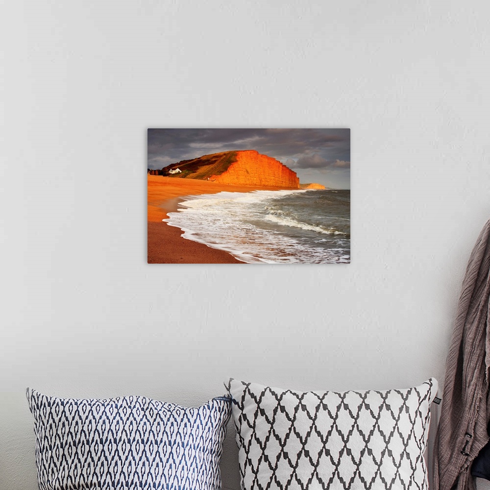 A bohemian room featuring English Channel, Dorset, View of the red limestone cliffs at West Bay, near Bridport