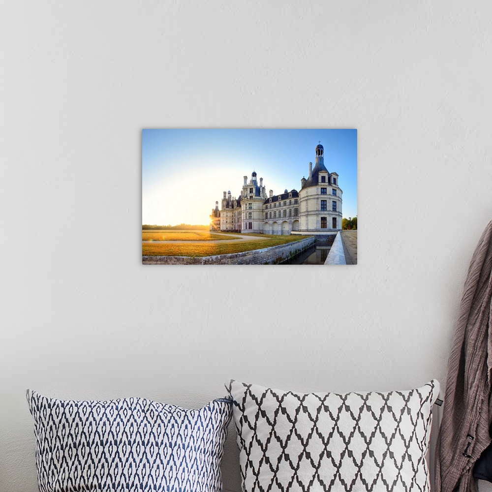 A bohemian room featuring France, Centre, Chambord Castle, sunrise behind Chambord castle.