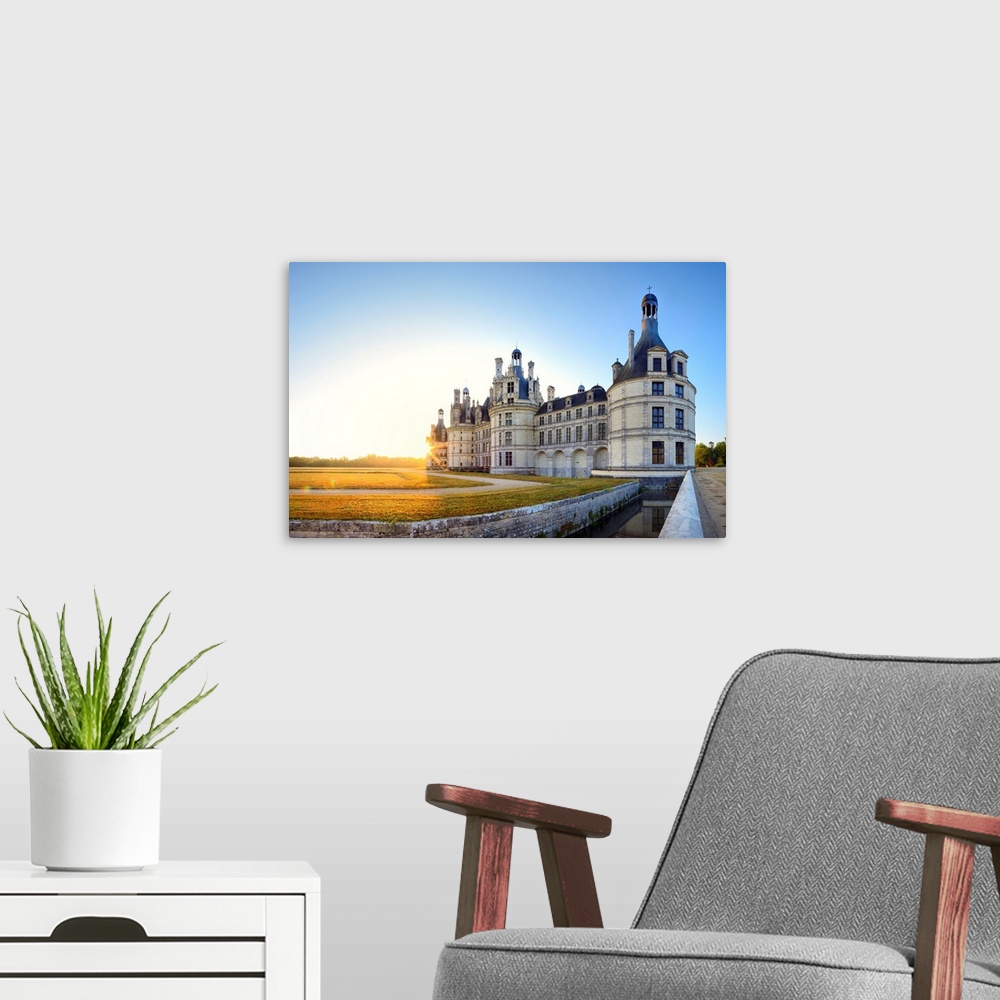 A modern room featuring France, Centre, Chambord Castle, sunrise behind Chambord castle.