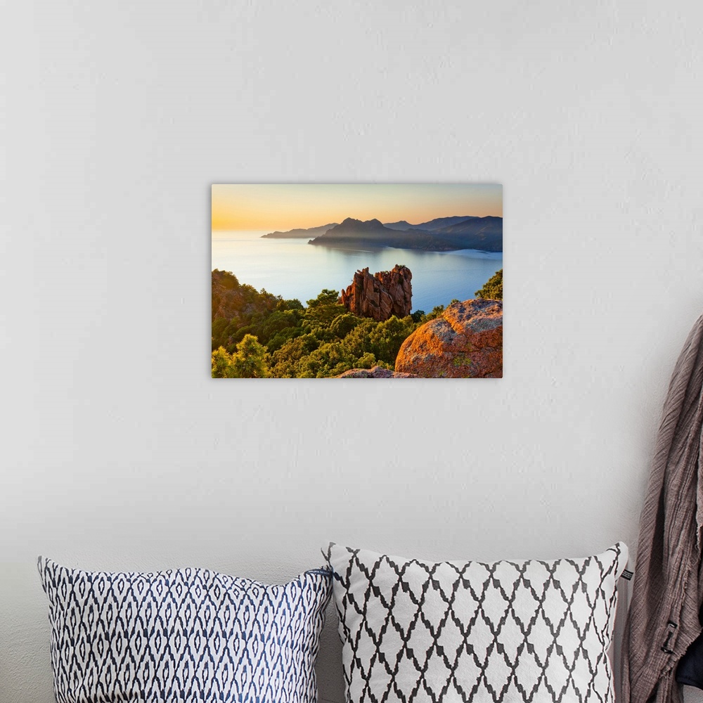A bohemian room featuring France, Corsica, Mediterranean sea, Corse-du-Sud, Calanques de Piana, Typical rock formations, dusk