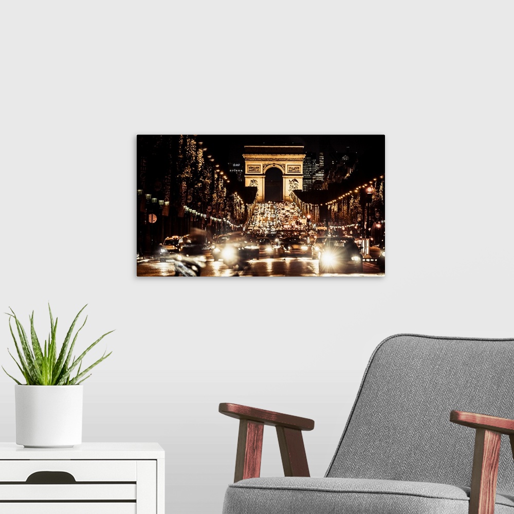 A modern room featuring France, Paris, Arc de Triomphe, The avenue Champs-elysees and the Arc de Triomphe at night.