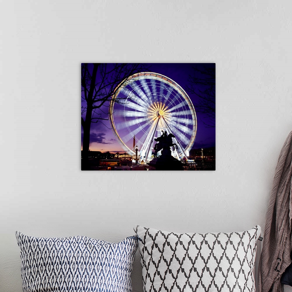 A bohemian room featuring France, Paris, Ferris wheel spinning at the Place de la Concorde, night