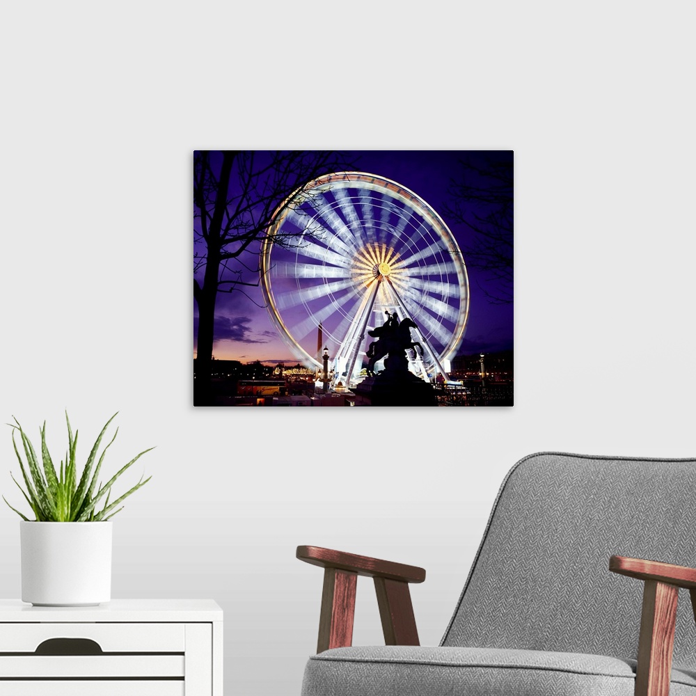 A modern room featuring France, Paris, Ferris wheel spinning at the Place de la Concorde, night