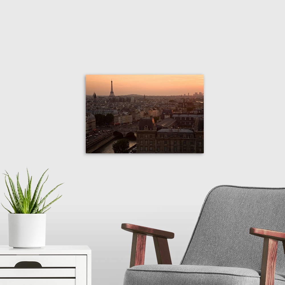 A modern room featuring France, Ile-de-France, Paris, View over the capital with Eiffel Tower in the background