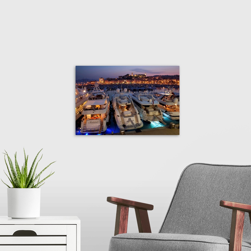 A modern room featuring France, Provence-Alpes-Cote d'Azur, Alpes-Maritimes, Cannes, Cannes, dusk