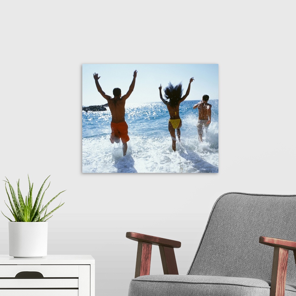 A modern room featuring Friends running into the ocean