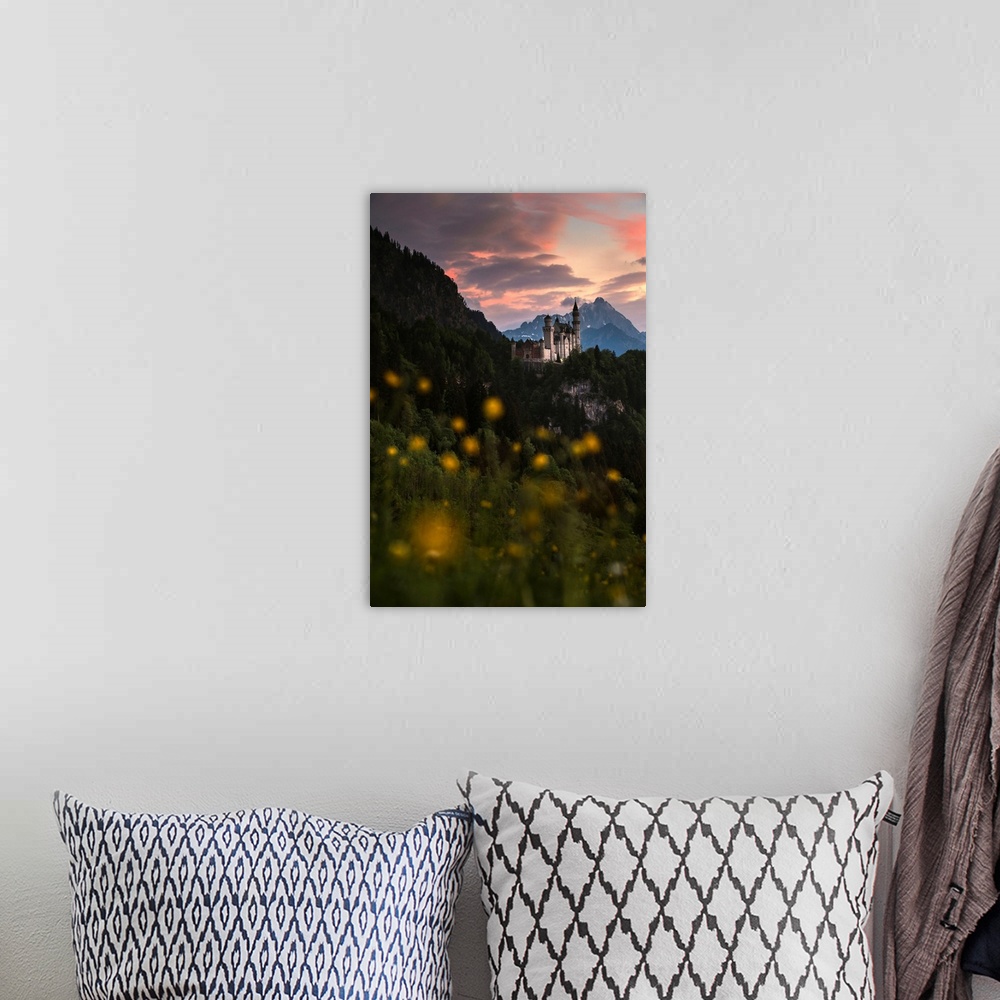 A bohemian room featuring Germany, Bavaria, Neuschwanstein castle and surrounding landscape with spring flower blossom at s...