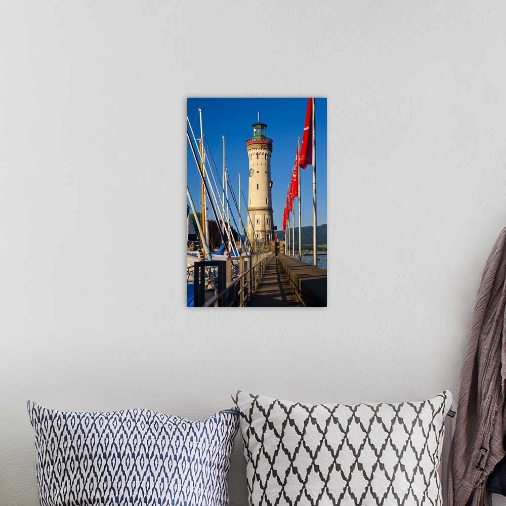 A bohemian room featuring Germany, Bavaria, Lake Constance, Swabia, Schwaben, Lindau, Lighthouse at the harbor entrance.
