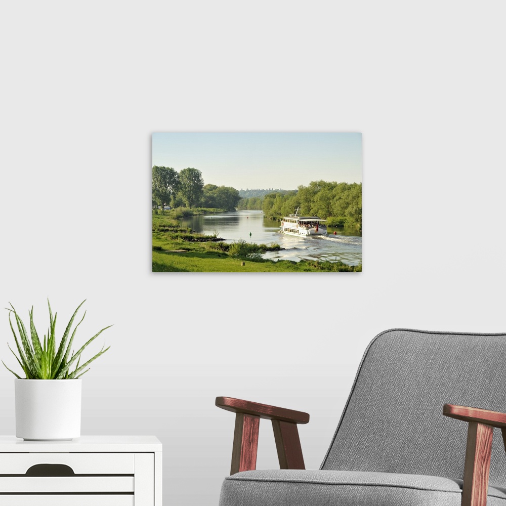 A modern room featuring Germany, North Rhine-Westphalia, Ruhr Area, Essen, Tourist boat on the Ruhr River.