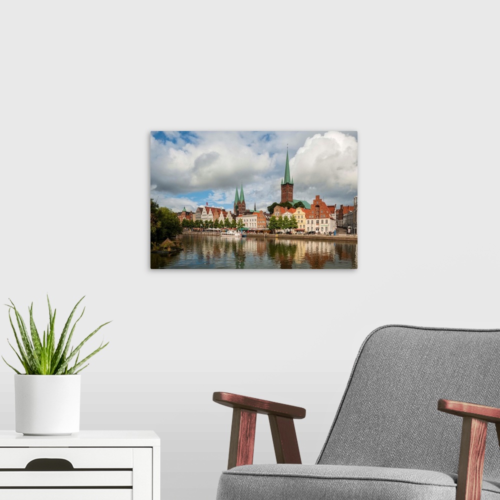 A modern room featuring Germany, Schleswig-Holstein, Lubeck, Petrikirche from Fussgangerbrucke on Trave Canal.