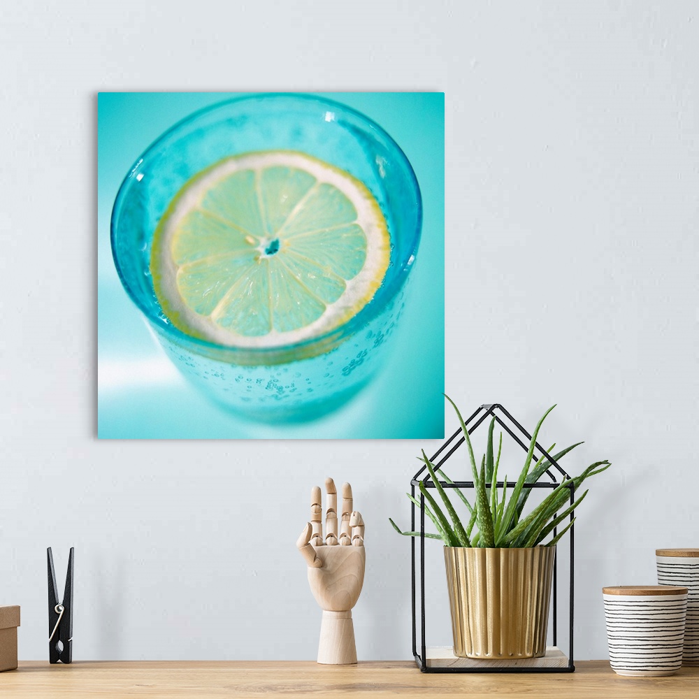 A bohemian room featuring Glass of water and lemon