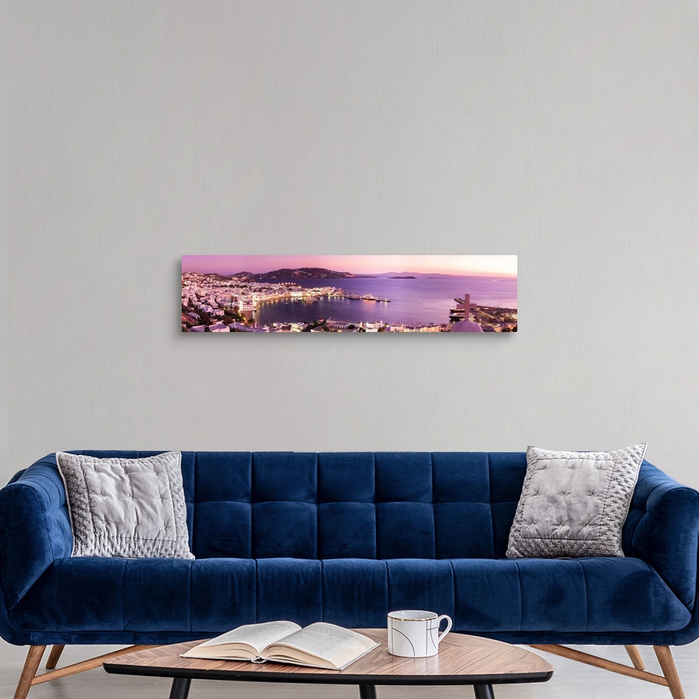 A modern room featuring Greece, Aegean islands, Cyclades, Mykonos, Chora and old harbor at sunset