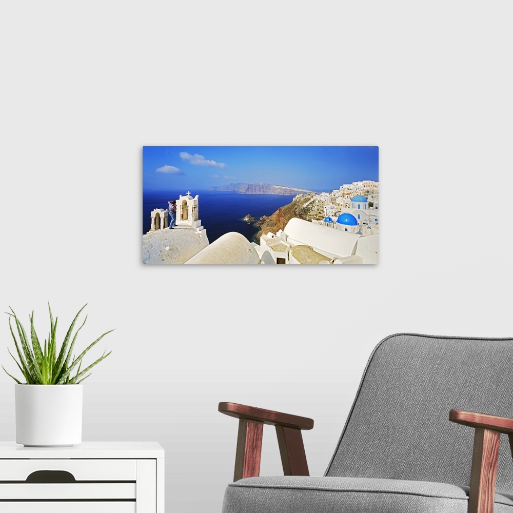 A modern room featuring Greece, Aegean islands, Cyclades, Santorini island, Oia, view towards the crater
