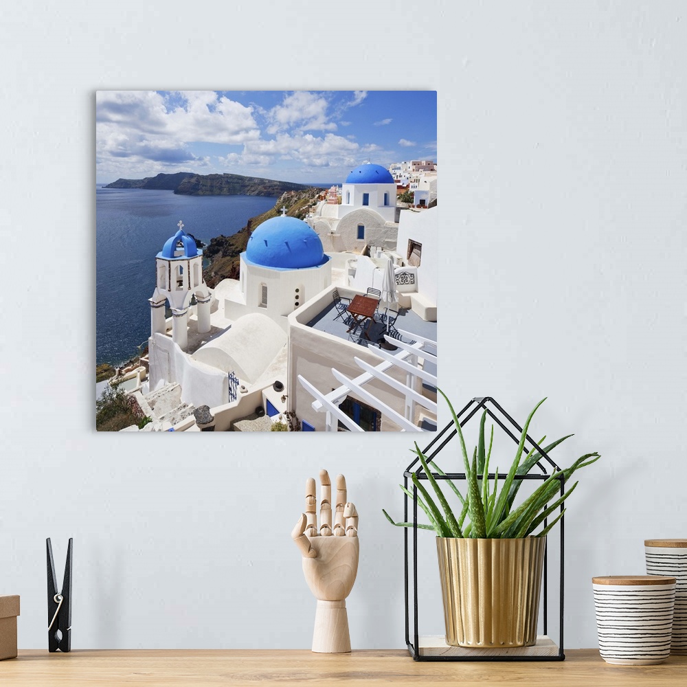 A bohemian room featuring Greece, Aegean islands, Cyclades, Santorini island, Greek Islands, Oia village, typical church.