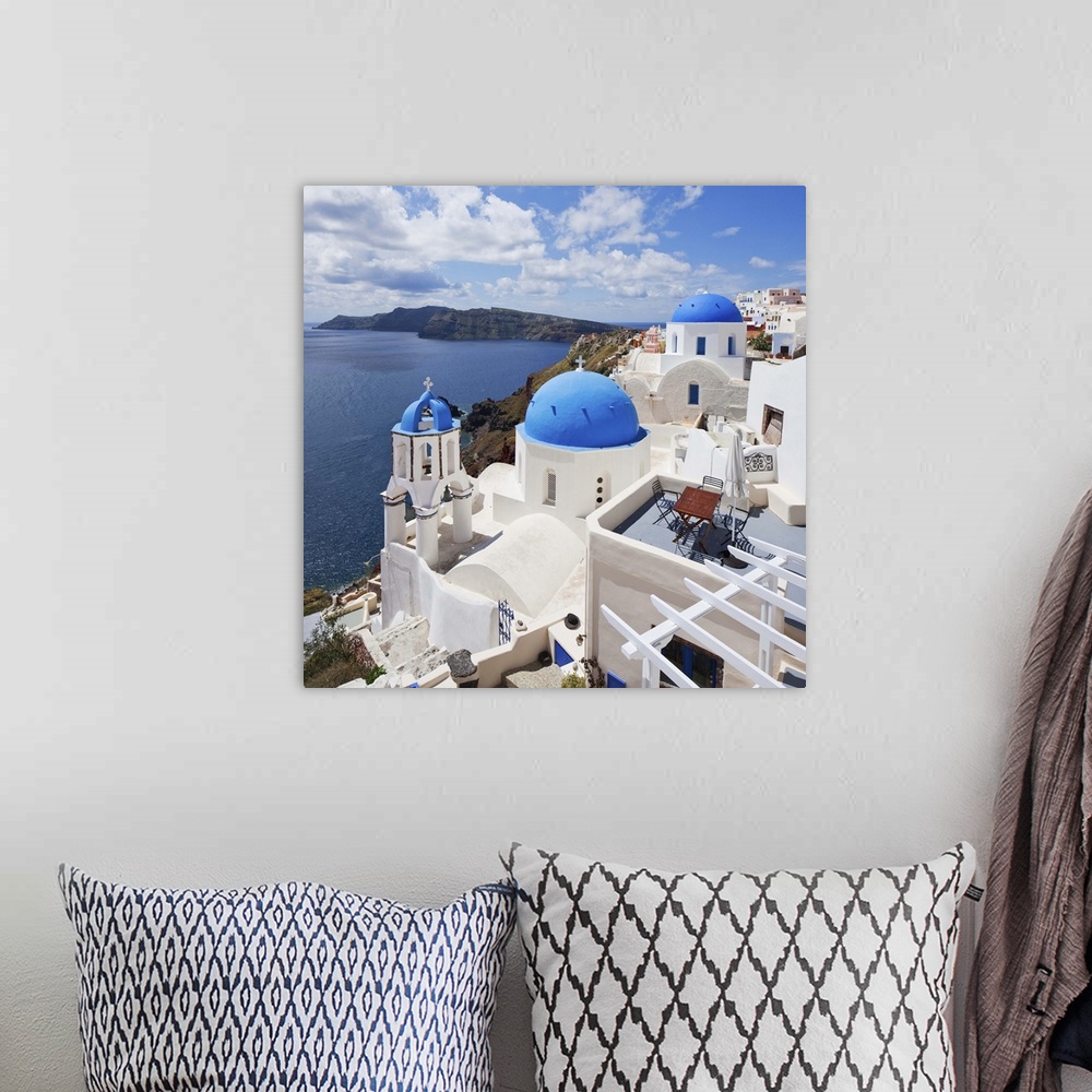 A bohemian room featuring Greece, Aegean islands, Cyclades, Santorini island, Greek Islands, Oia village, typical church.