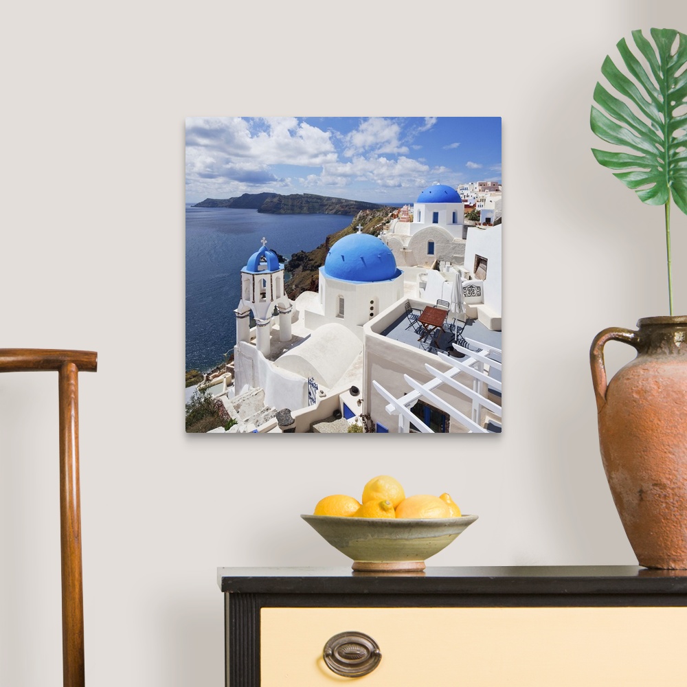 A traditional room featuring Greece, Aegean islands, Cyclades, Santorini island, Greek Islands, Oia village, typical church.