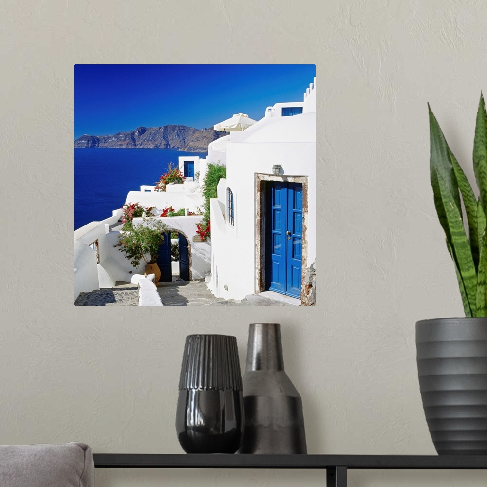 A modern room featuring Greece, Aegean islands, Cyclades, Santorini, traditional houses and the crater