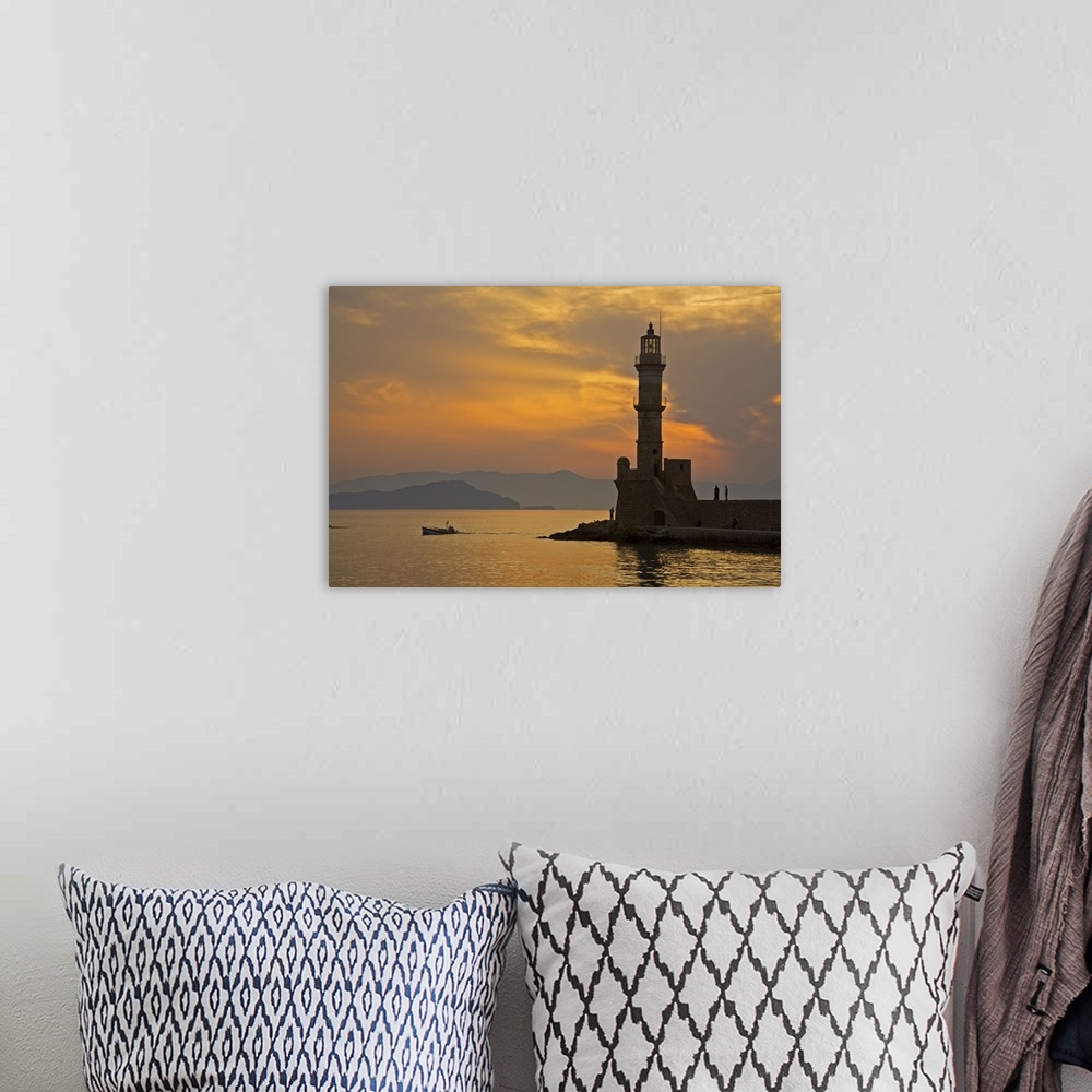 A bohemian room featuring Greece, Crete, Chania, Venetian lighthouse in Chania harbor at sunset