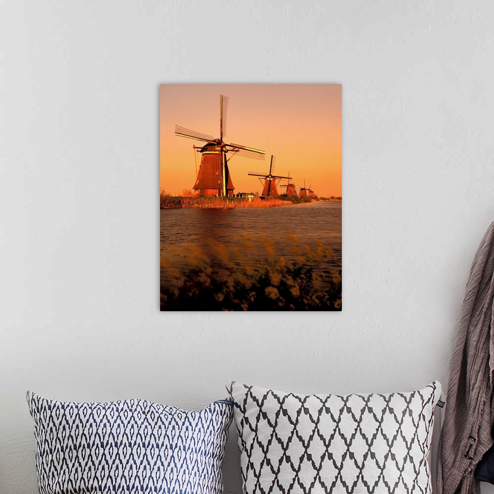 A bohemian room featuring Holland, windmills at Kinderdijk, sunset