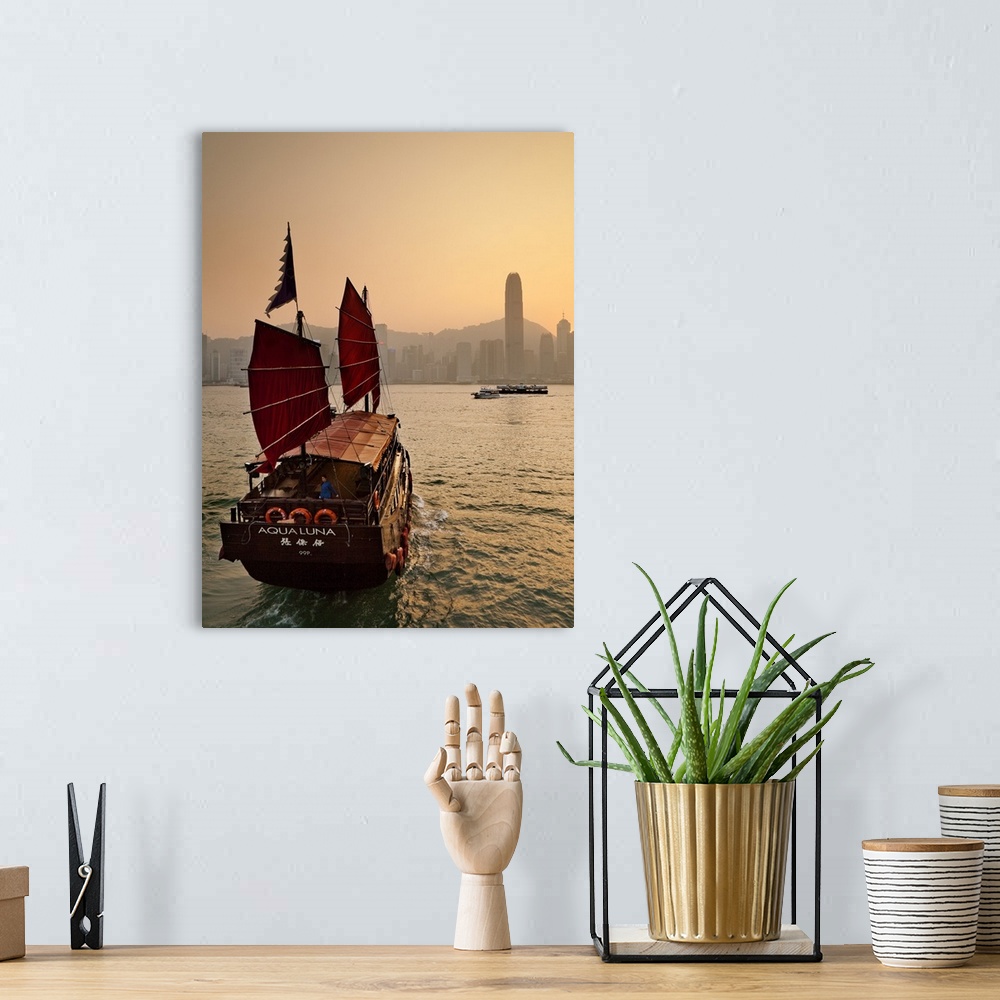 A bohemian room featuring China, Hong Kong, Hong Kong island, Victoria Harbor, Traditional junk in the Victoria Harbor with...