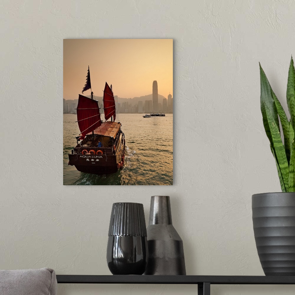 A modern room featuring China, Hong Kong, Hong Kong island, Victoria Harbor, Traditional junk in the Victoria Harbor with...