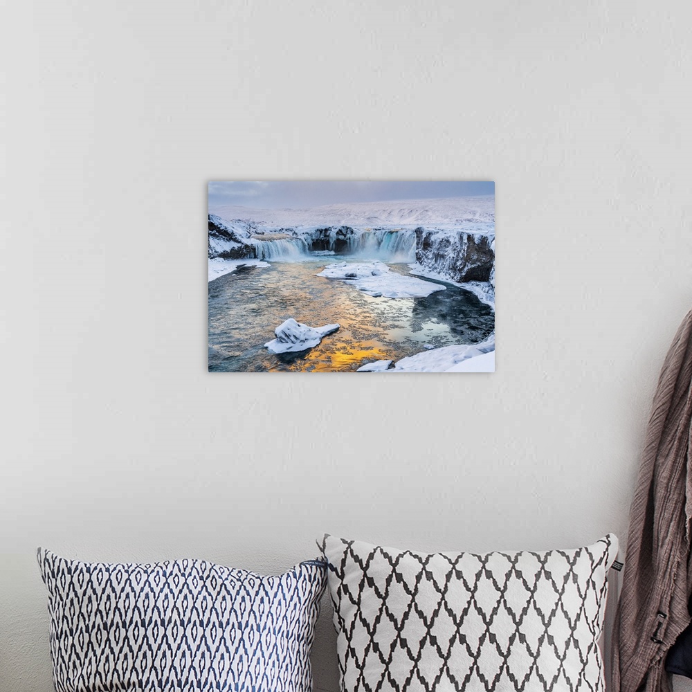 A bohemian room featuring Iceland, Northeast Iceland, Sunset over a snow-covered Godafoss.
