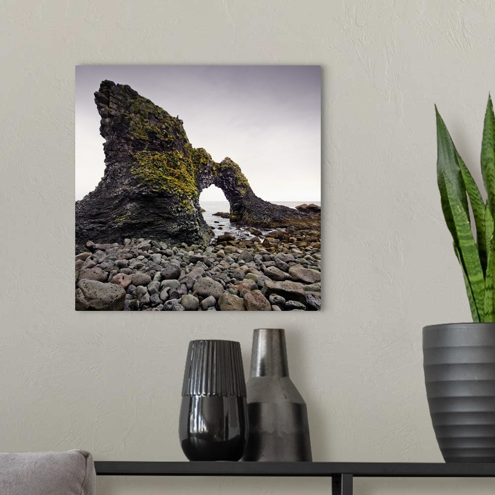 A modern room featuring Iceland, West Iceland, Snaefellsnes, Natural Rock arch at Arnastapi.