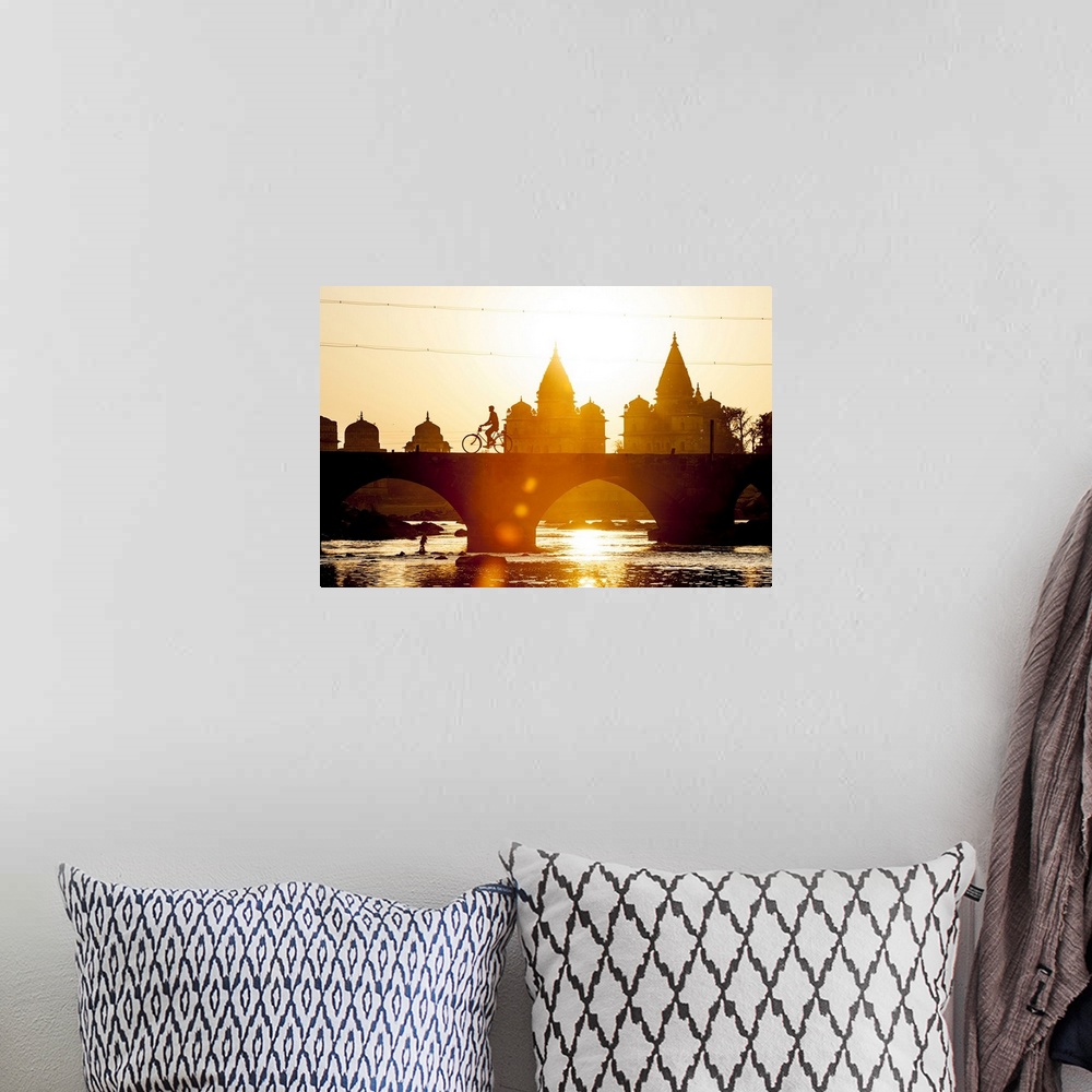 A bohemian room featuring India, Madhya Pradesh, Orchha, Sunset view of Chhatris on the banks of the Betwa River