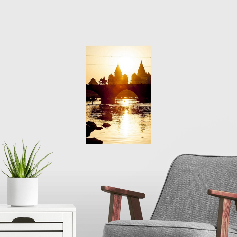 A modern room featuring India, Madhya Pradesh, Orchha, Sunset view of Chhatris on the banks of the Betwa River