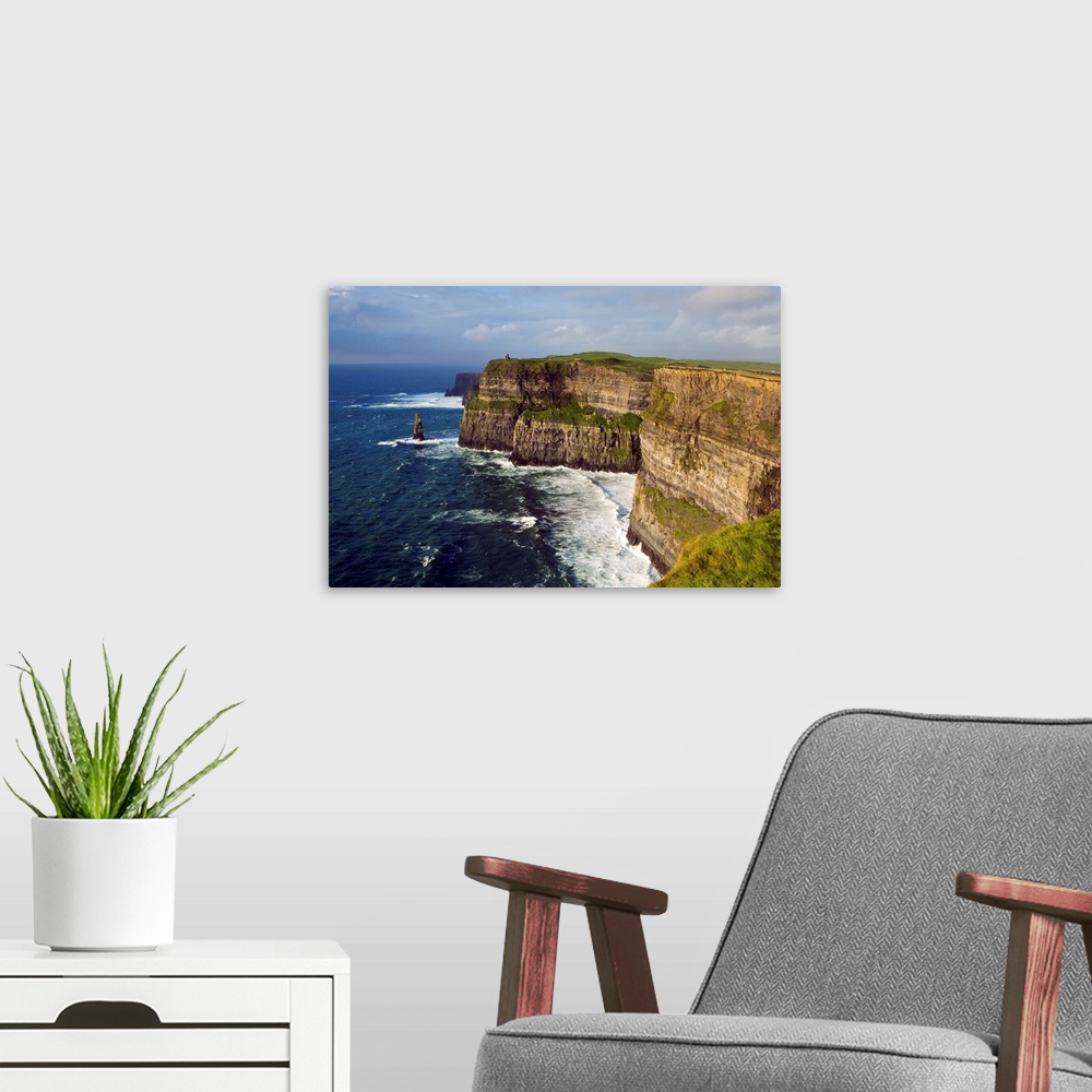 A modern room featuring Ireland, Clare, waves generated by Atlantic Ocean storms pound base of Cliffs of Moher