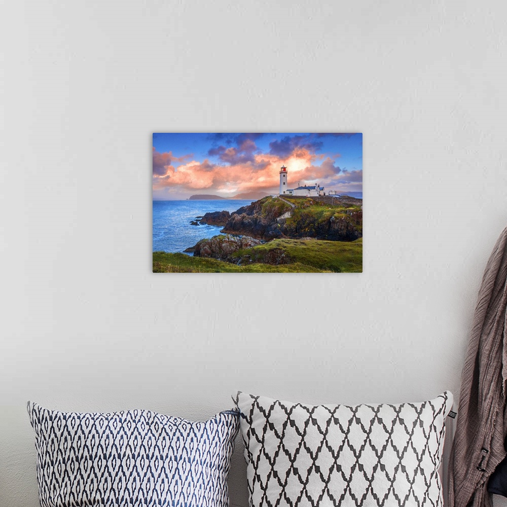 A bohemian room featuring Ireland, Donegal, Fanad Head lighthouse at sunrise.
