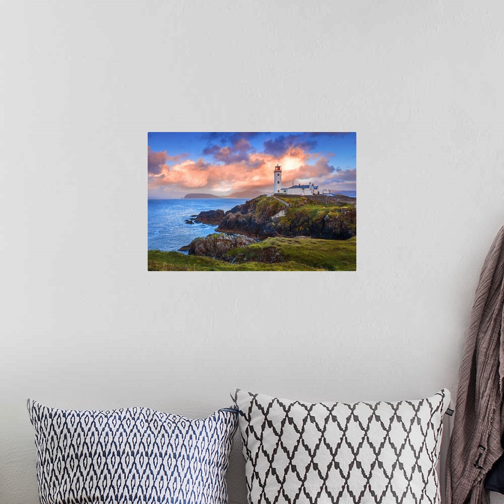 A bohemian room featuring Ireland, Donegal, Fanad Head lighthouse at sunrise.