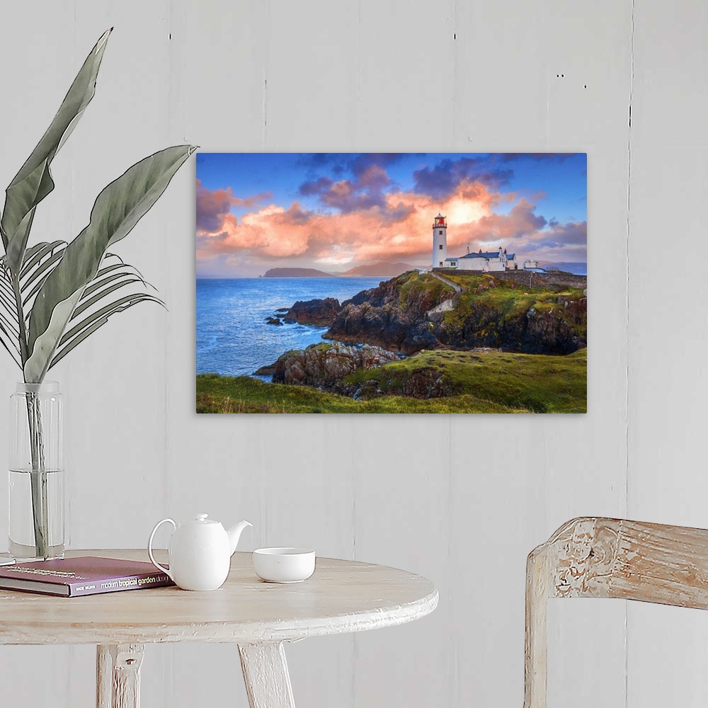 A farmhouse room featuring Ireland, Donegal, Fanad Head lighthouse at sunrise.
