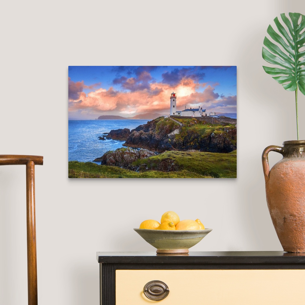 A traditional room featuring Ireland, Donegal, Fanad Head lighthouse at sunrise.