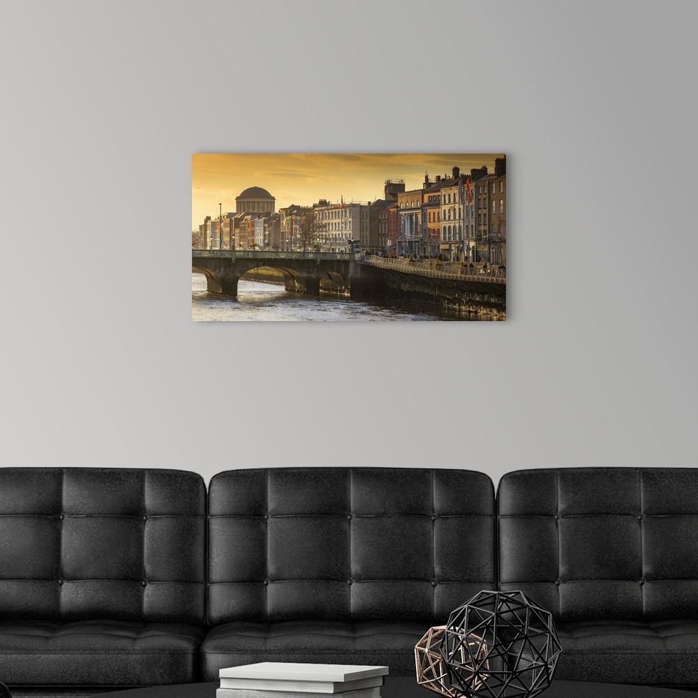 A modern room featuring Ireland, Dublin, Panoramic view of Dublin's skyline at sunset.